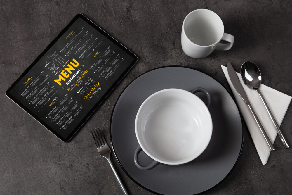 Empty plate and tableware with online order menu Empty plate and tableware with online order menu