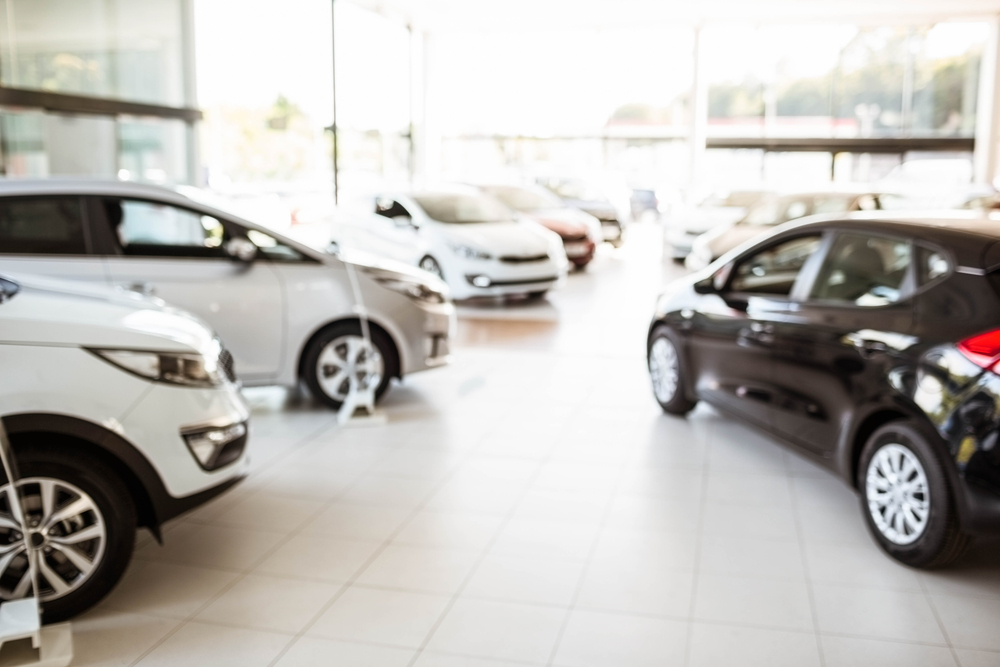 View of row new car at car dealership View of row new car at car dealership